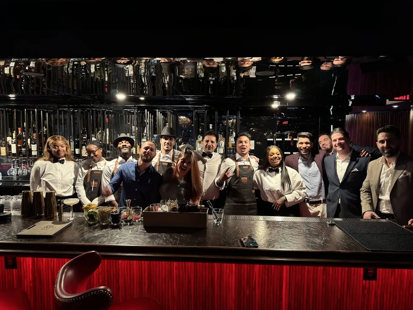 Restaurant and bar team behind the bar