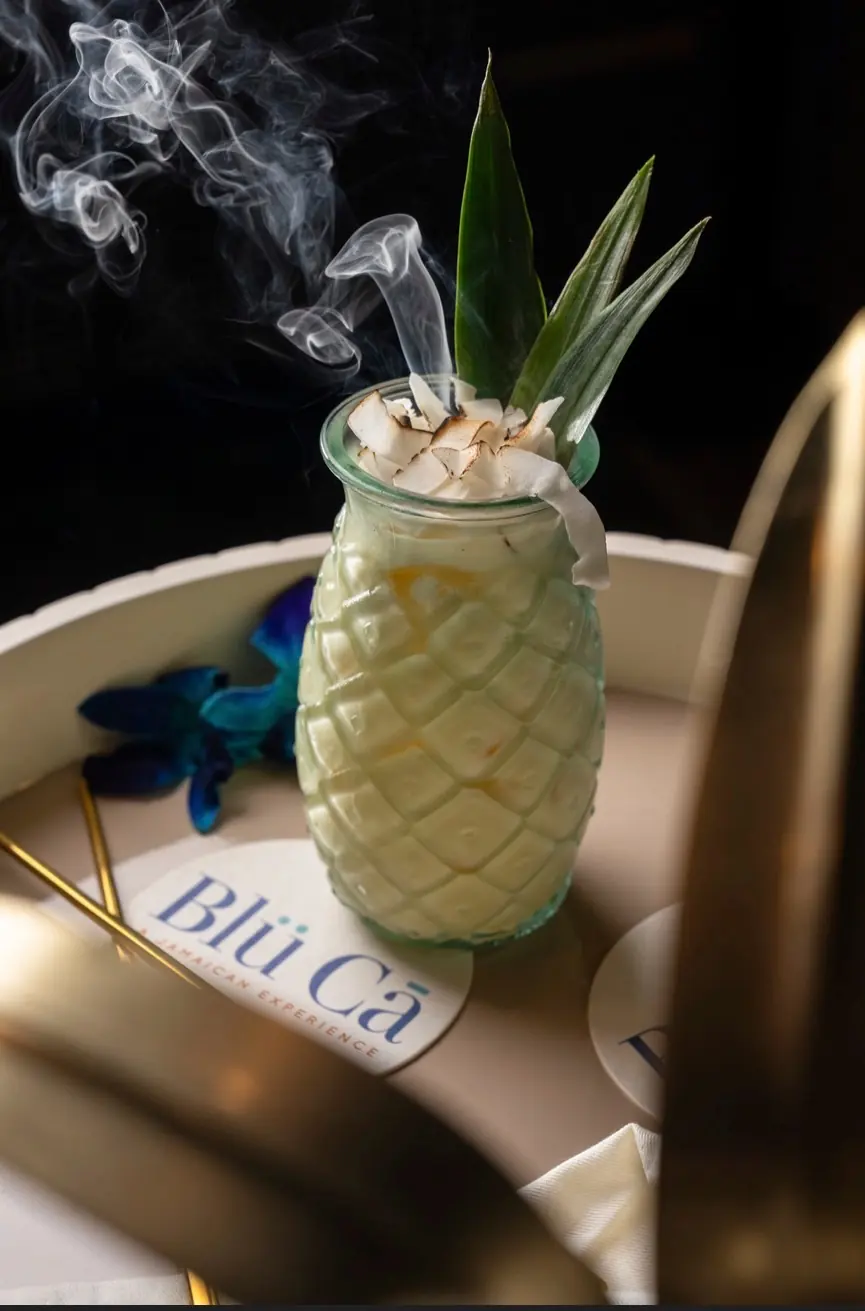 Smoked coconut cocktail served in a pineapple glass